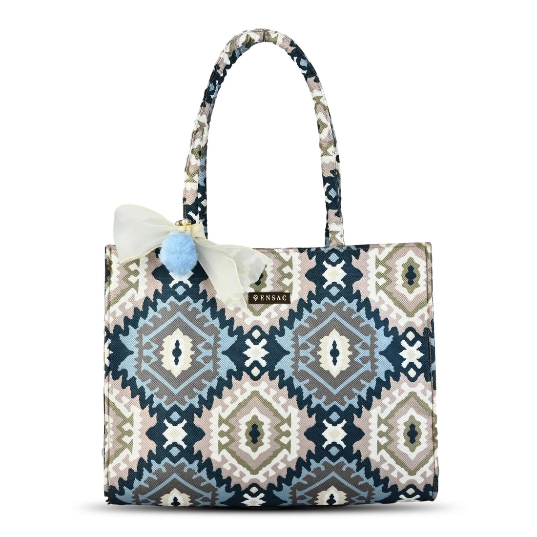 Woman holding a patterned tote bag in an outdoor setting BY ENSAC