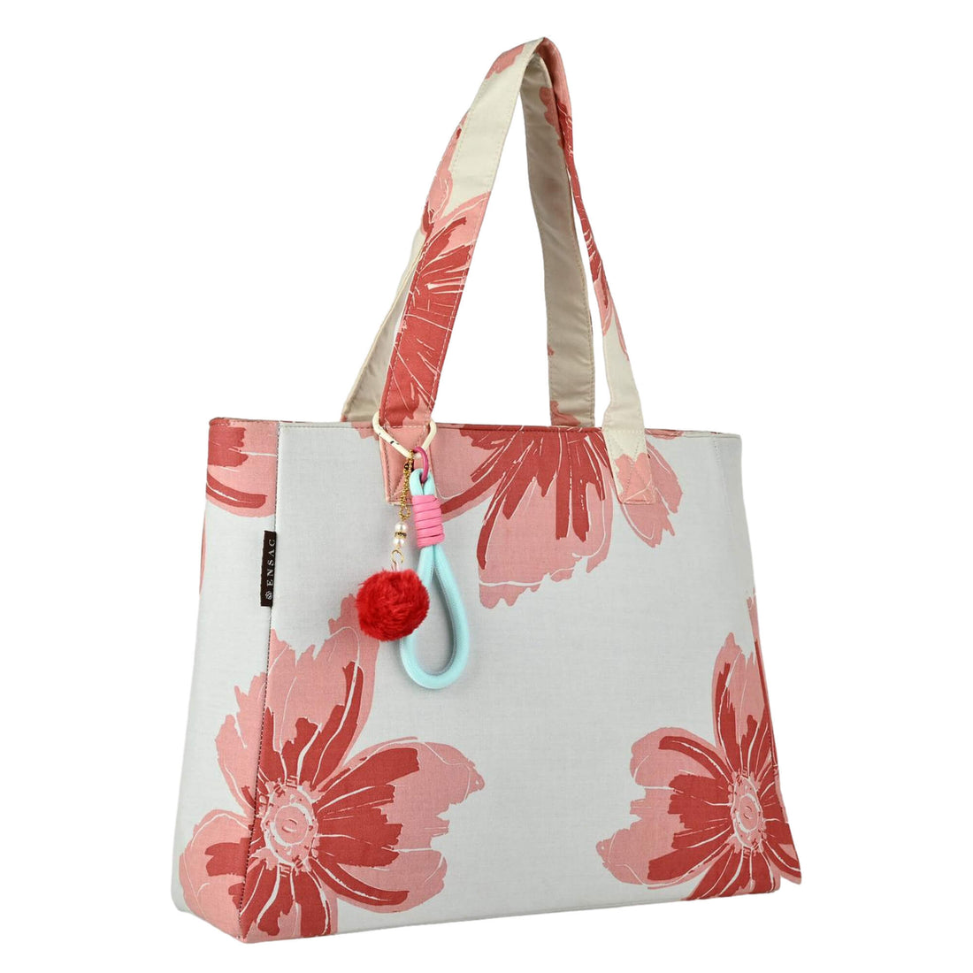 Floral tote bag with a pom-pom charm on a white background by ENSAC