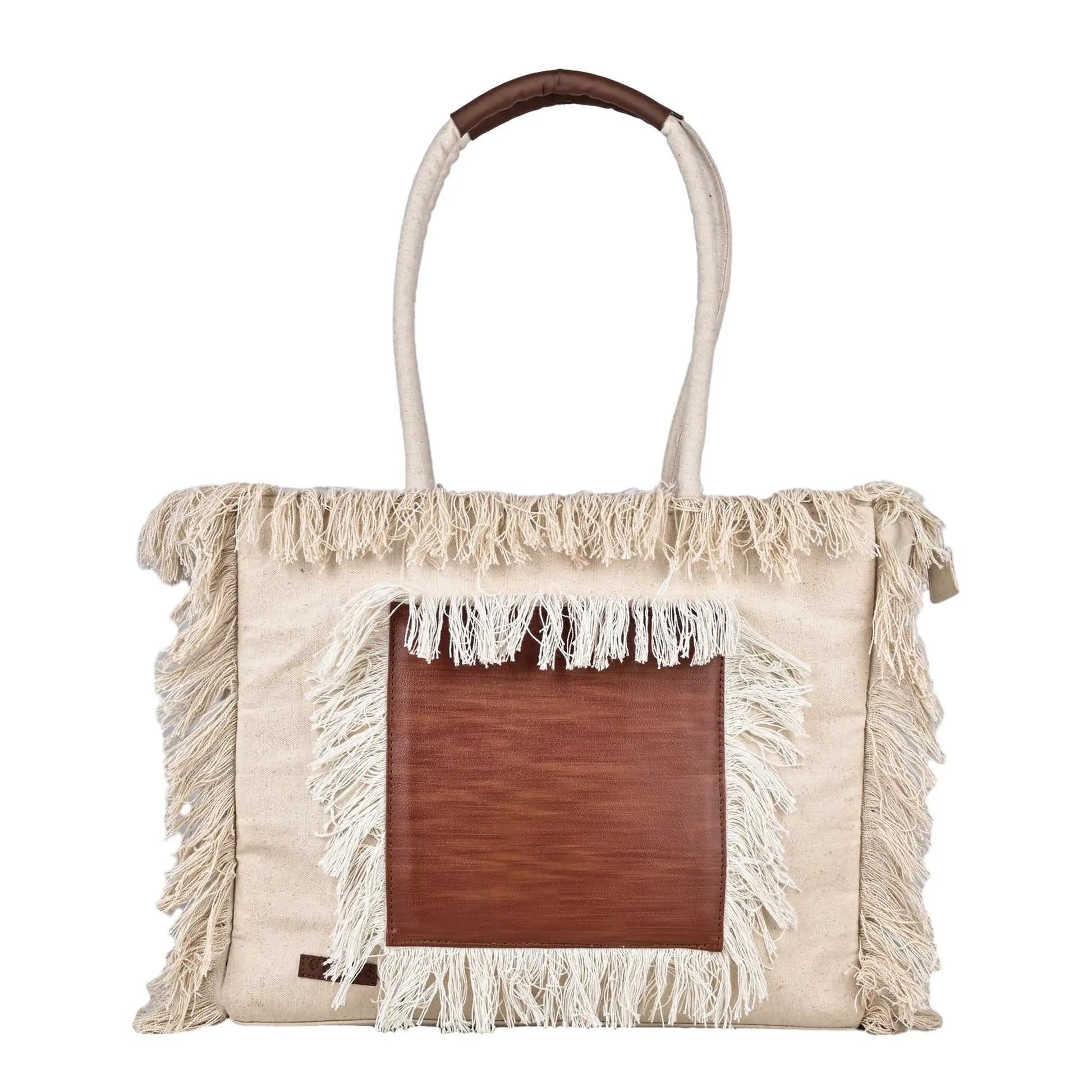 Beige tote bag with brown leather patch and fringes on a white background