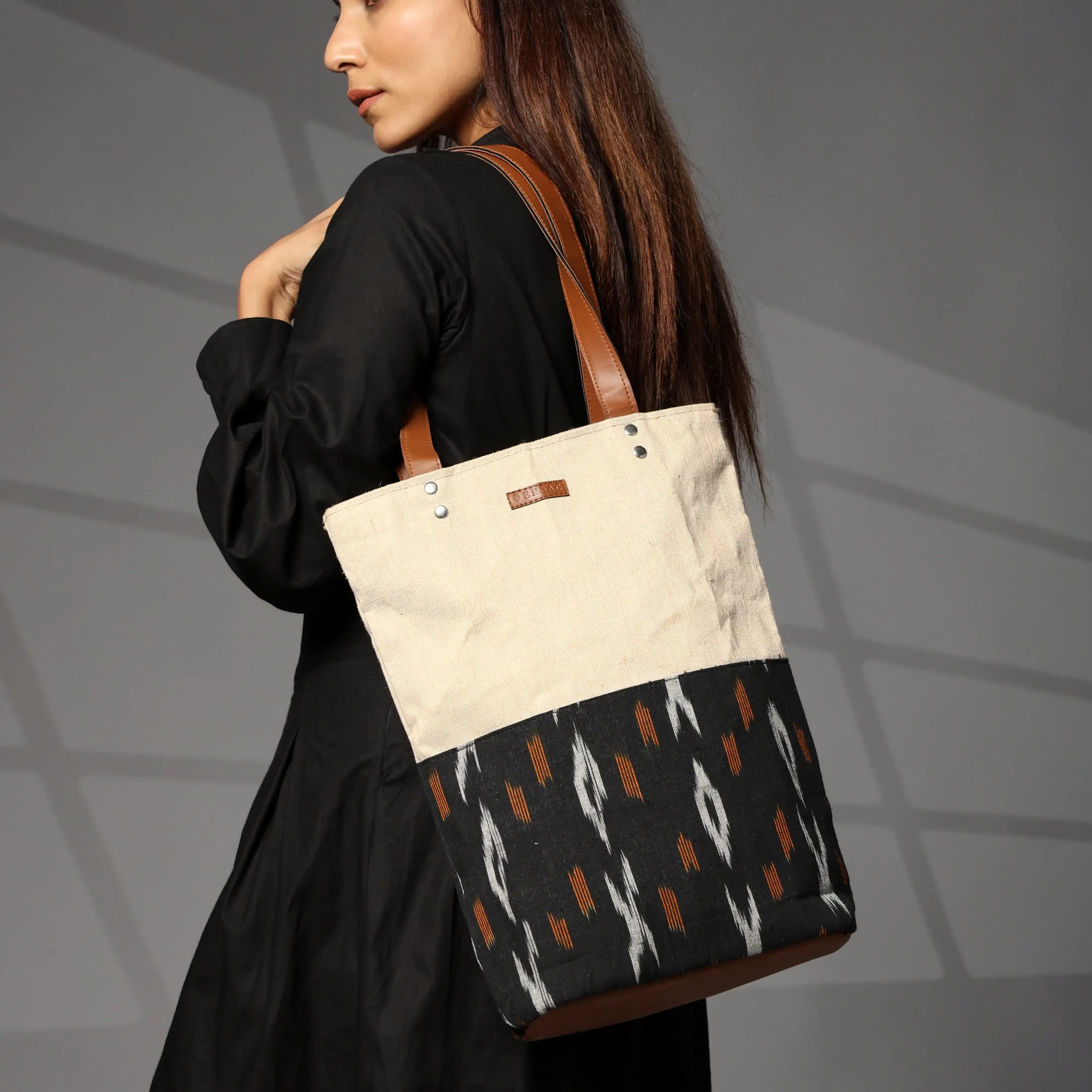 Black and beige ikkat jute tote bag with brown straps for women by Ensac