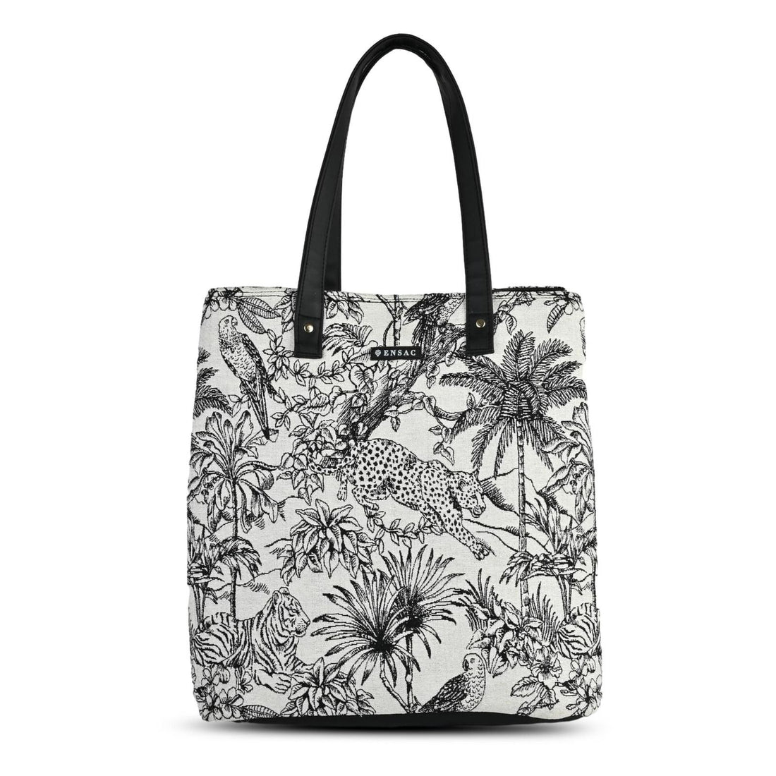 Tote bag with black and white floral and animal pattern on a couch in a living room setting BY ENSAC
