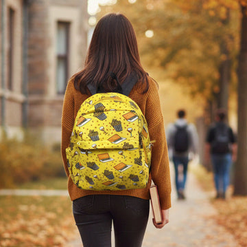 Person with a yellow backpack walking on a path in an autumn setting BY ENSAC