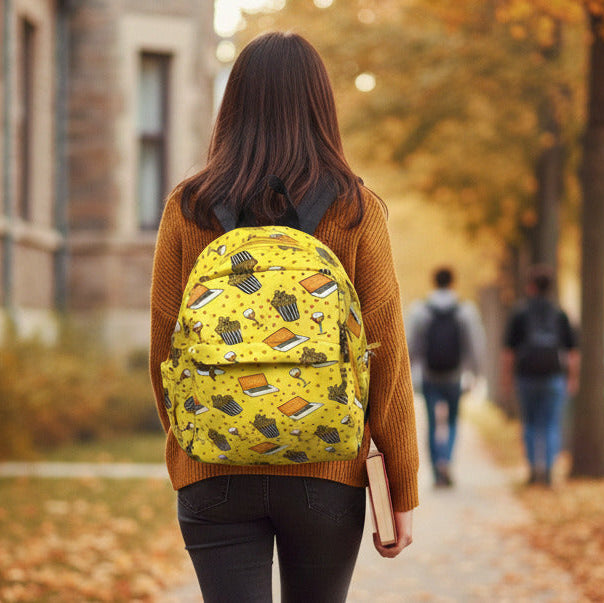Person with a yellow backpack walking on a path in an autumn setting BY ENSAC