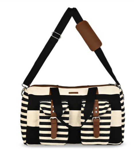 Black and white striped bag with brown accents on a white background BY ENSAC